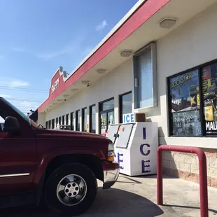 a truck parked in front of a store