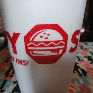 a plastic cup with a logo on it