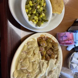 Chicken and dumplin&apos;s, fried catfish, okra and tomatoes, Lima beans, corn bread, hot roll. Great lunch.