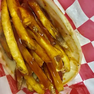 Cleveland Polish Boy loaded with fresh cut fries and BBQ, make sure to lick Yoo finger  after