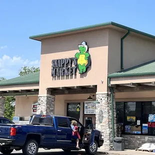 a truck parked in front of the store