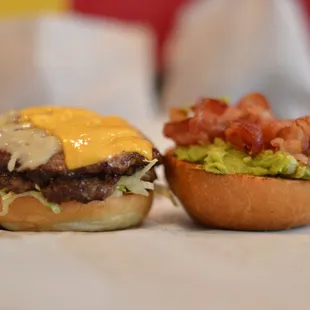 two burgers on a table