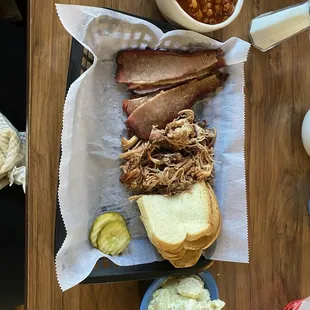 2 meat meal with baked beans and potato salad.