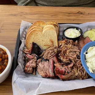 Three meat plate - burnt ends, ham, pulled port with BBQ beans and potato salad
