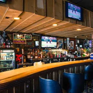 the bar and televisions in the background