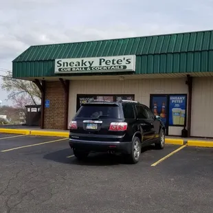 a car parked in front of the store