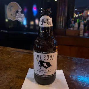 a bottle of beer on a napkin