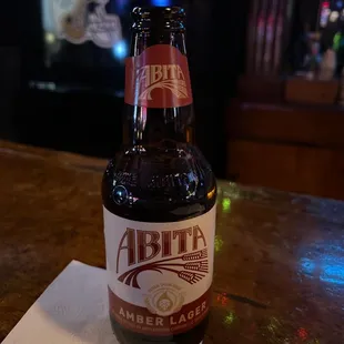 a bottle of beer on a napkin