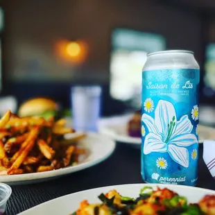 a plate of fries and a can of soda