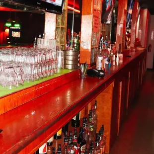 bottles of liquor lined up on a bar