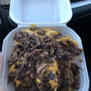 pulled beef and cheese in a styrofoam container
