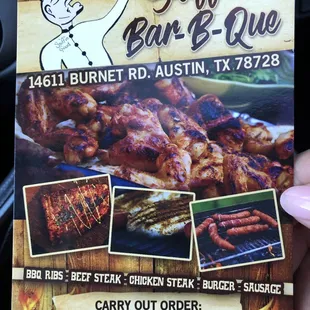 a hand holding a menu