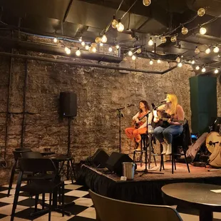 a group of musicians playing on stage