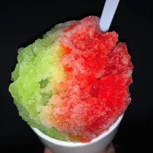 a hand holding a cup of ice