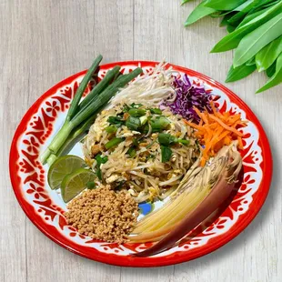 a plate of noodles and vegetables