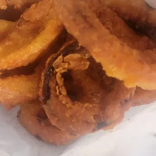 went to snow-white took a bite of a onion rings they are hard n burnt now I have a chipped tooth.the guy needs cooking lessons