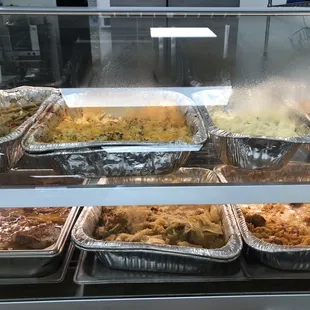 a variety of food in aluminum containers