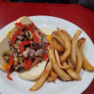 Cheesesteak sandwich with fries