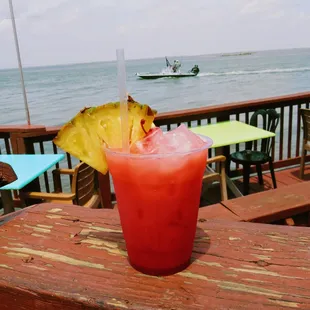 a drink with a pineapple garnish