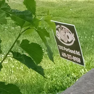 a sign in the grass
