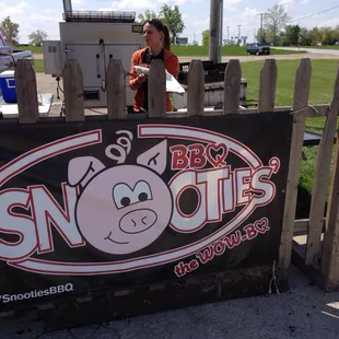 Large smoker to back. Grill in front of cook. All outside