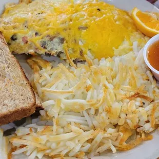 Snooty pig omlette, hash browns, wheat toast.