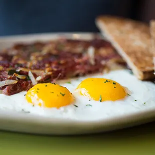  two fried eggs on a plate