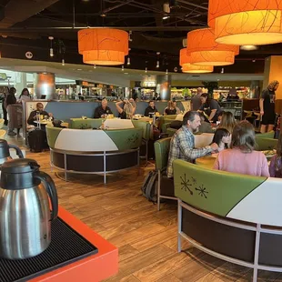 From the back seats of the restaurant, looking toward the front. Fun view of United planes out the window