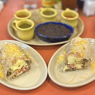 Snooze Breakfast Burrito: scrambled eggs, hash browns, black beans (OTS), cheese, pico de gallo (inside), green &amp; red sauce (OTS) | $14.75