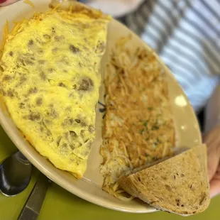 Sausage and Cheddar Omelette with Crispy hash browns and Rye toast