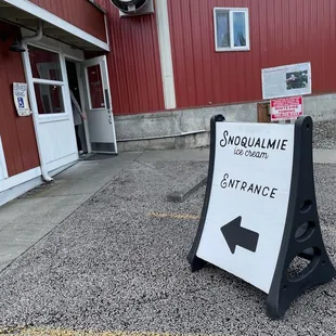 a sign in front of a building