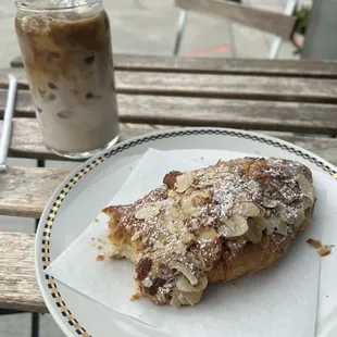 Iced oat latte and an almond croissant