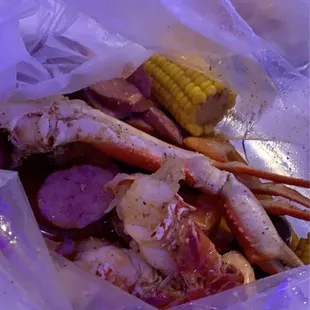 Snow crab, corn, potatoes, shrimp, and sausage seafood boil with mild spice.