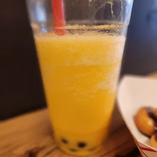 Passionfruit Tea with boba. Not real tea, more of an artificially flavored smoothie with boba.