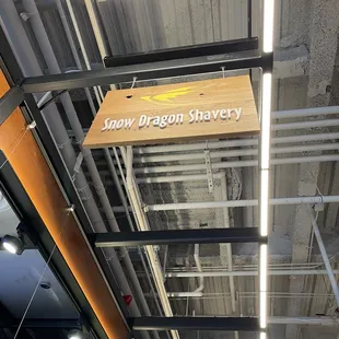 a sign hanging from the ceiling