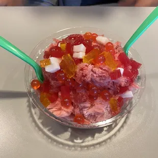 Shaved snow with strawberry popping boba and rainbow jelly