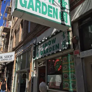 a woman walking down the sidewalk