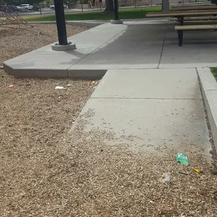 More trash in the playground area