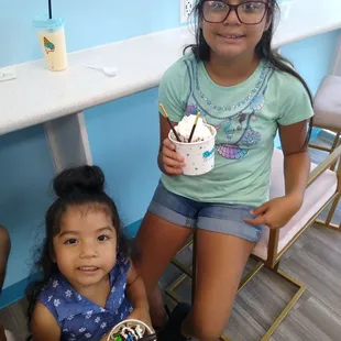 Baby girls enjoying some ice cream