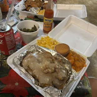 Smothered pork chops, lemon pepper wings, cornbread, Mac and cheese, yams and greens.