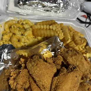 Chicken wing plate with fries and macaroni