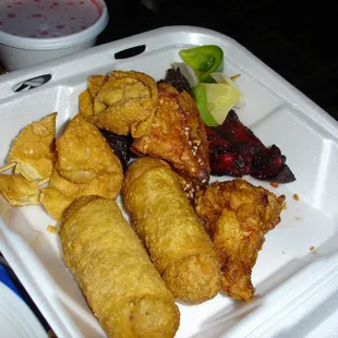 Pupu Tray for Two. Two of Everything (Kebab, Egg Roll, Shrimp toast, Rangoon, BBQ Rib) minus Chicken Wings. © 2006 @FOODEMIC.