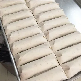 a tray of donuts on a conveyor belt