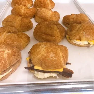 a tray of breakfast sandwiches