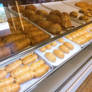 a display case with a variety of donuts