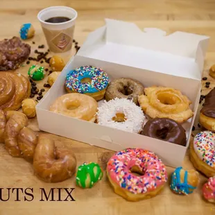 Donuts [Apple fritter, cinnamon roll, cinnamon twist, eclair, icing donuts, glazed, blueberry cake, old fashion cake, donut holes]