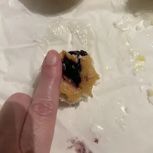 Finger for size reference.