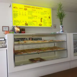 a counter with a variety of pastries