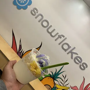 a hand holding a smoothie