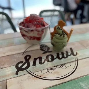 Strawberry snow and taiyaki in a bowl with matcha ice cream, chocolate sprinkles and wafer